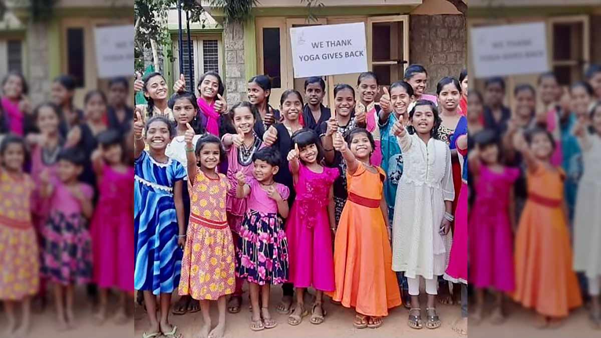 Yoga Gives back-INDIAN GIRLS HOLDING A THANK YOU SIGN